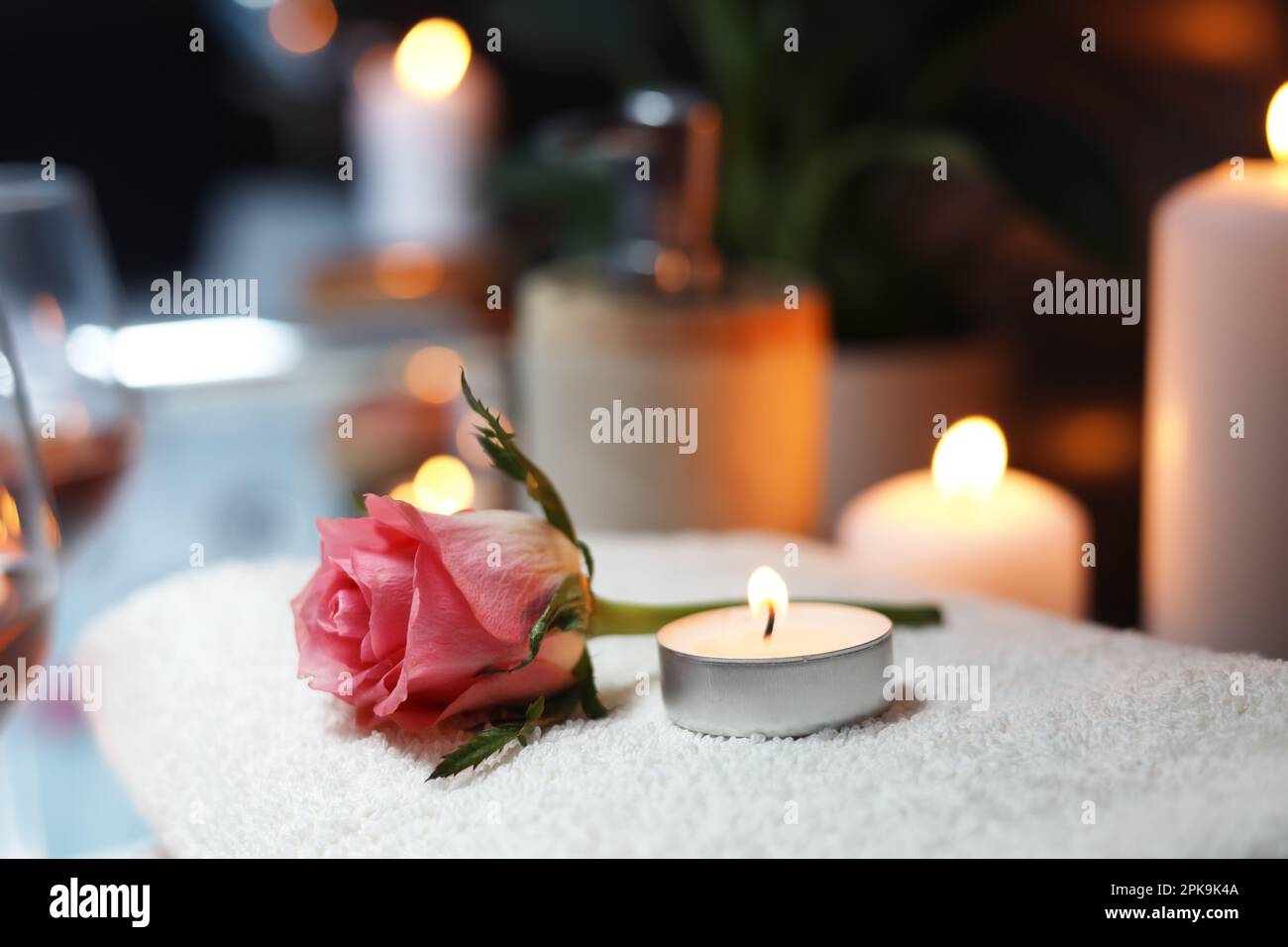 Burning candle rose petals hi-res stock photography and images - Alamy