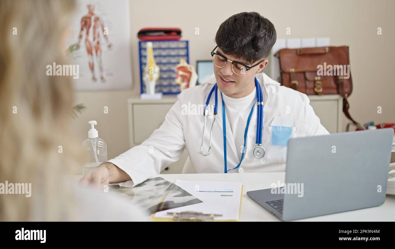 Hispanic man speaking to doctor hi-res stock photography and images - Alamy