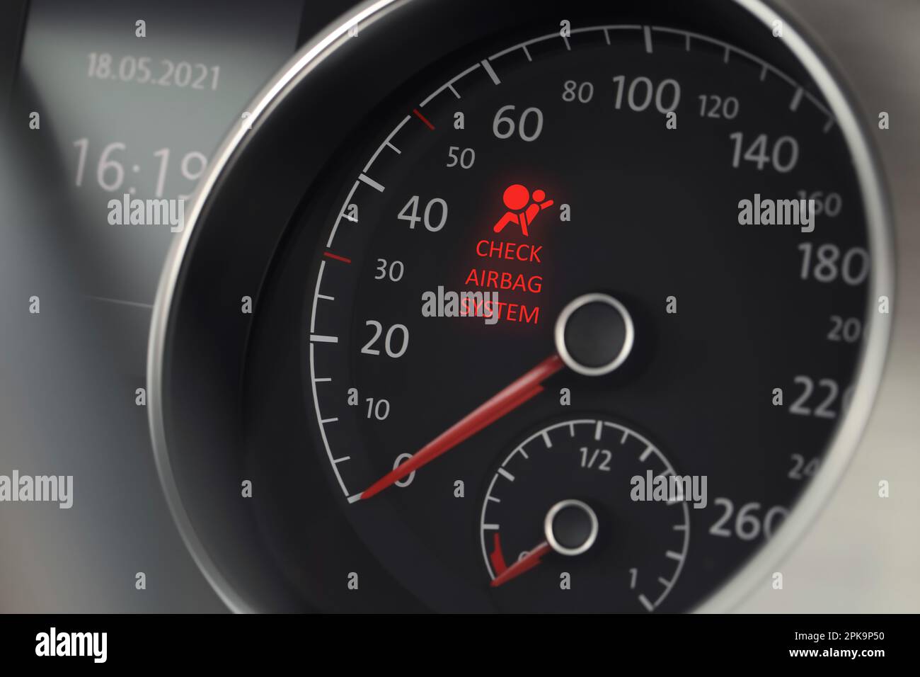 Closeup view of dashboard with warning icon check airbag system in car