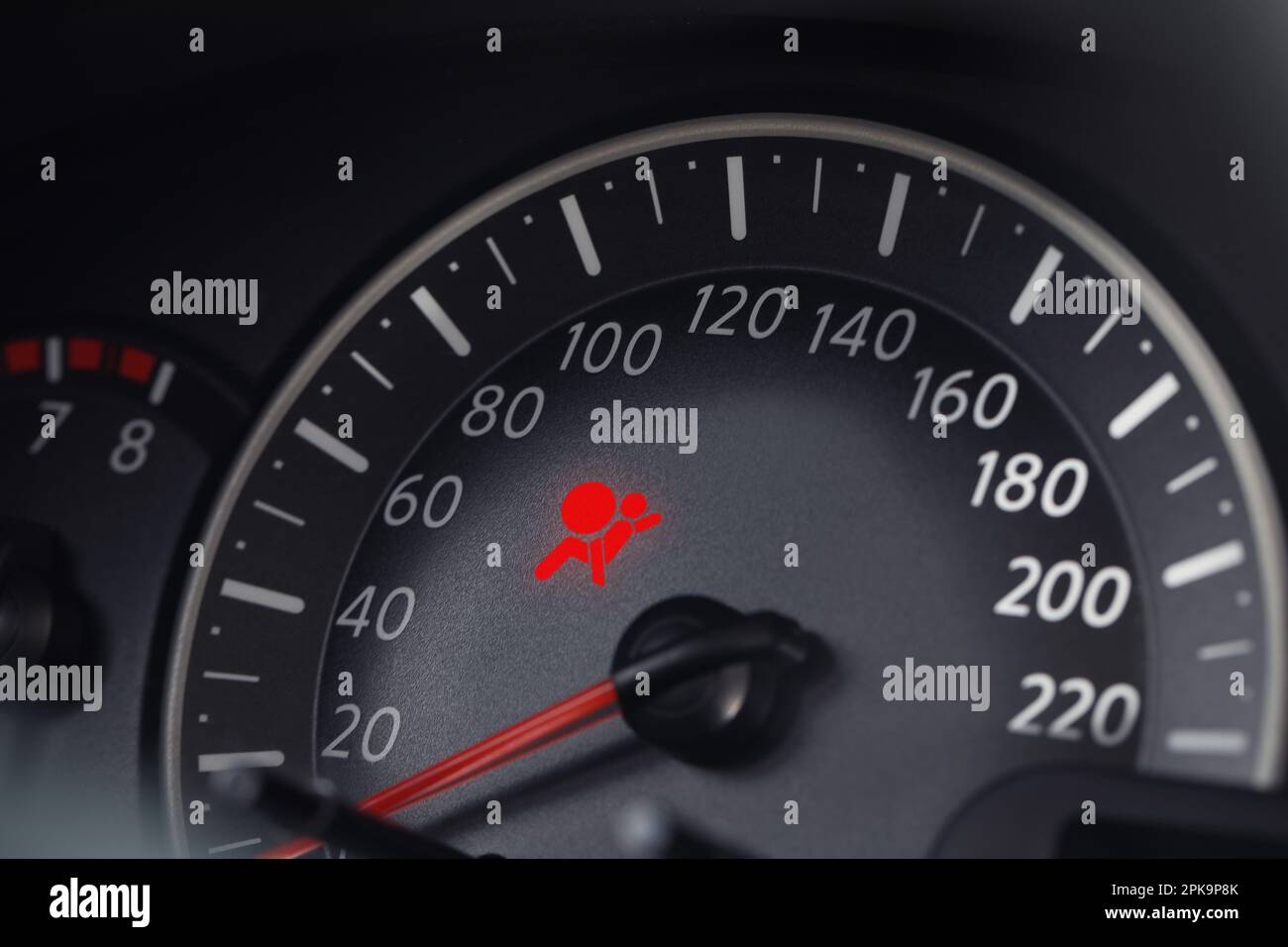 Closeup view of dashboard with warning icon check airbag system in car