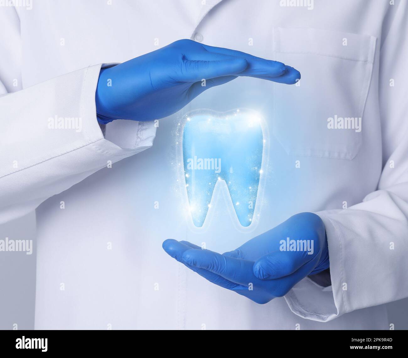Dentist demonstrating virtual model of healthy tooth, closeup Stock