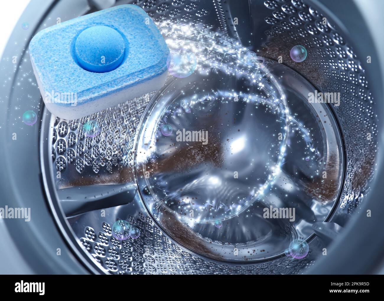 Water softener tablet in washing machine drum, closeup Stock Photo Alamy