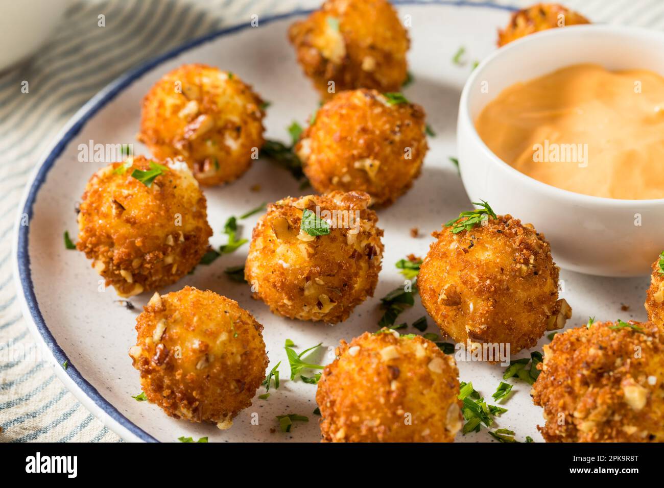 Deep Fried Goat Cheese Balls Appetizer with Dipping Sauce Stock Photo