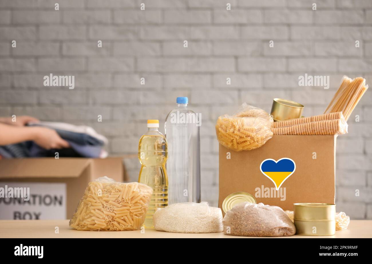Humanitarian aid for Ukrainian refugees. Donation box with food on