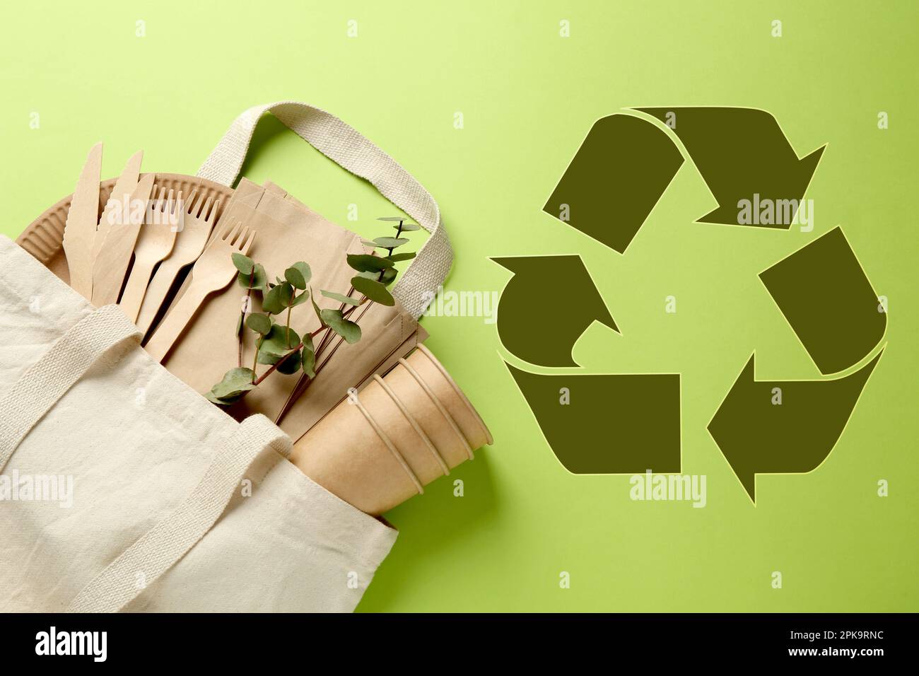 Flat lay composition with eco friendly products and recycling symbol on ...