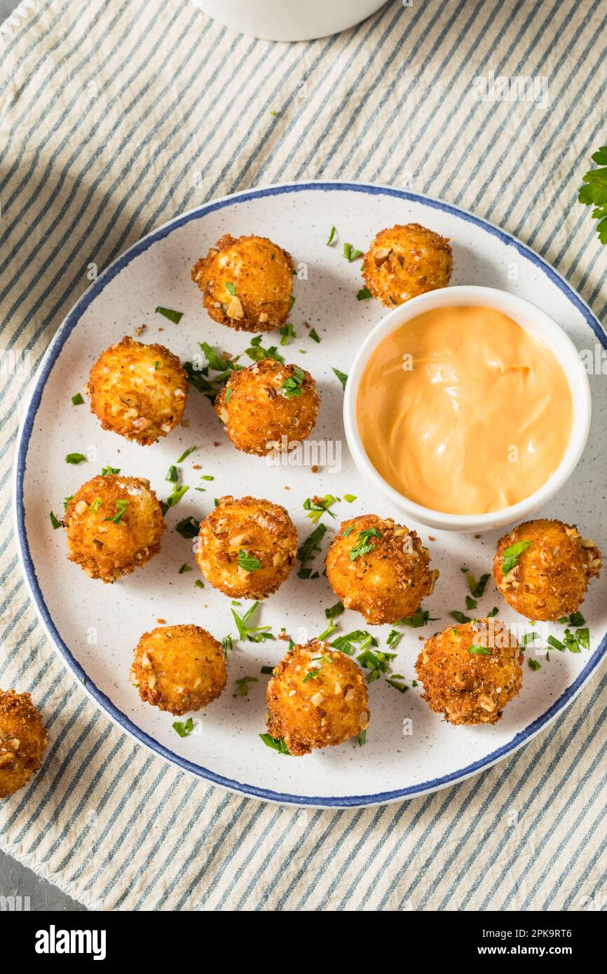 Deep Fried Goat Cheese Balls Appetizer with Dipping Sauce Stock Photo
