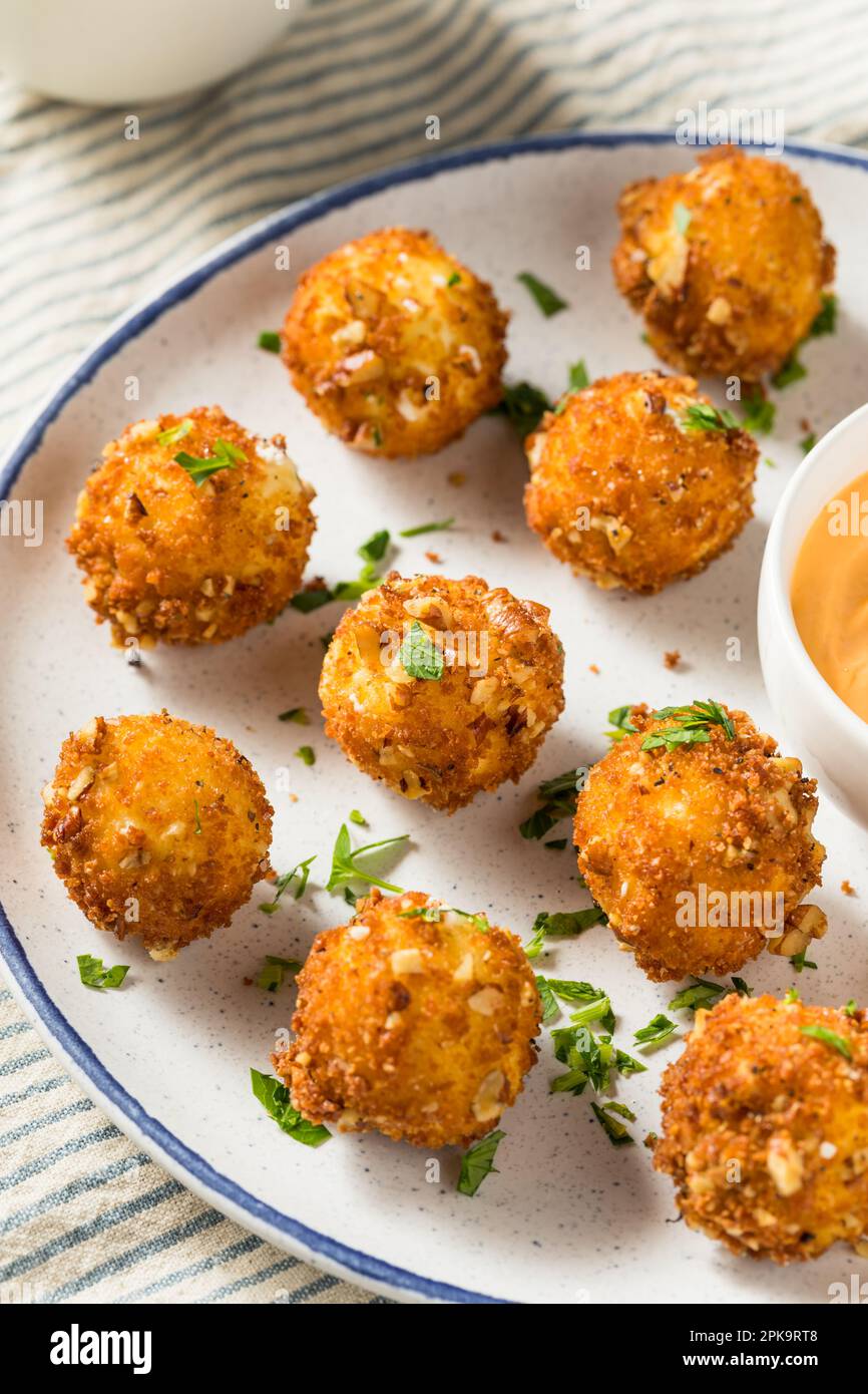 Deep Fried Goat Cheese Balls Appetizer with Dipping Sauce Stock Photo
