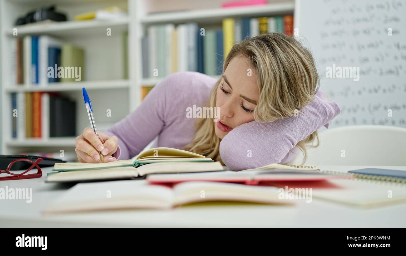 Being Rushed Taking Notes Young blonde woman student tired writing notes at classroom Stock Photo ...