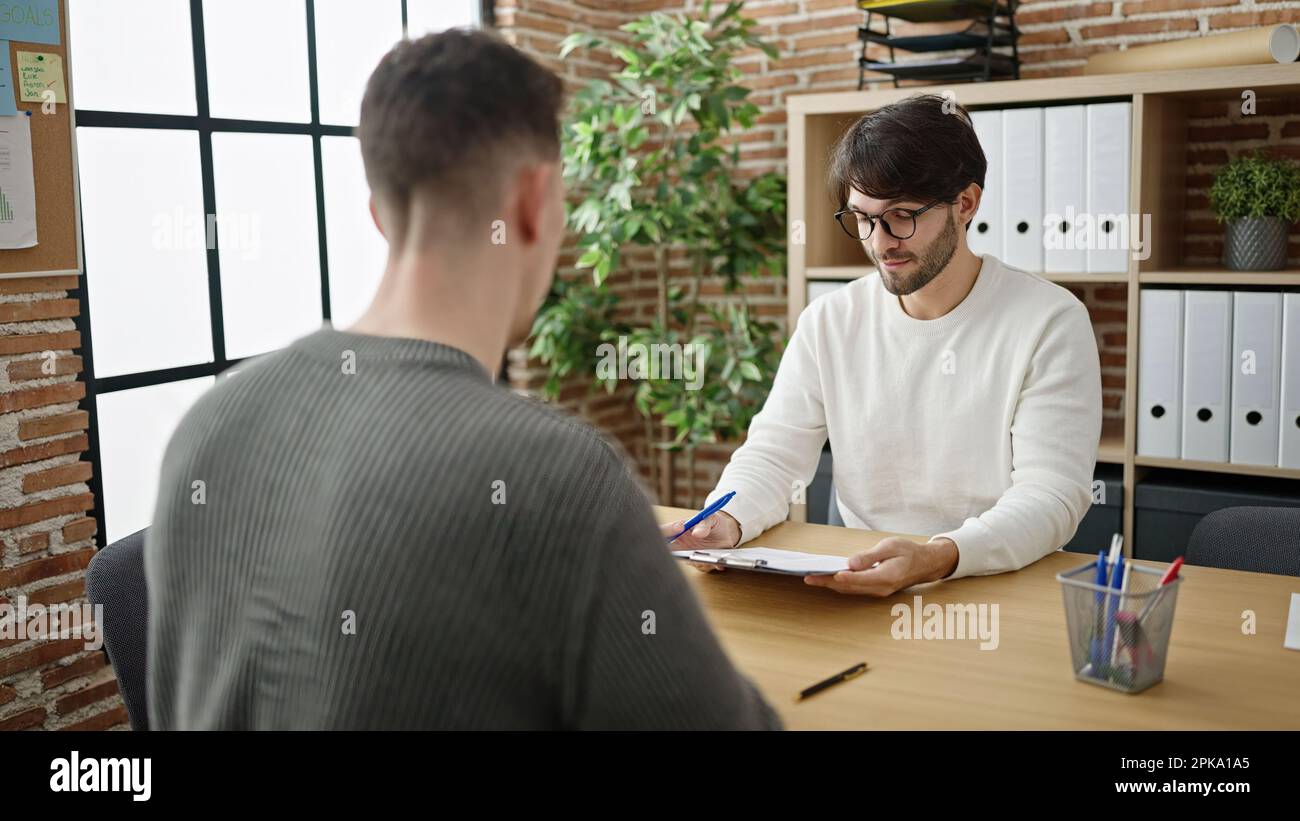 Business partners sign contract two hi-res stock photography and images ...