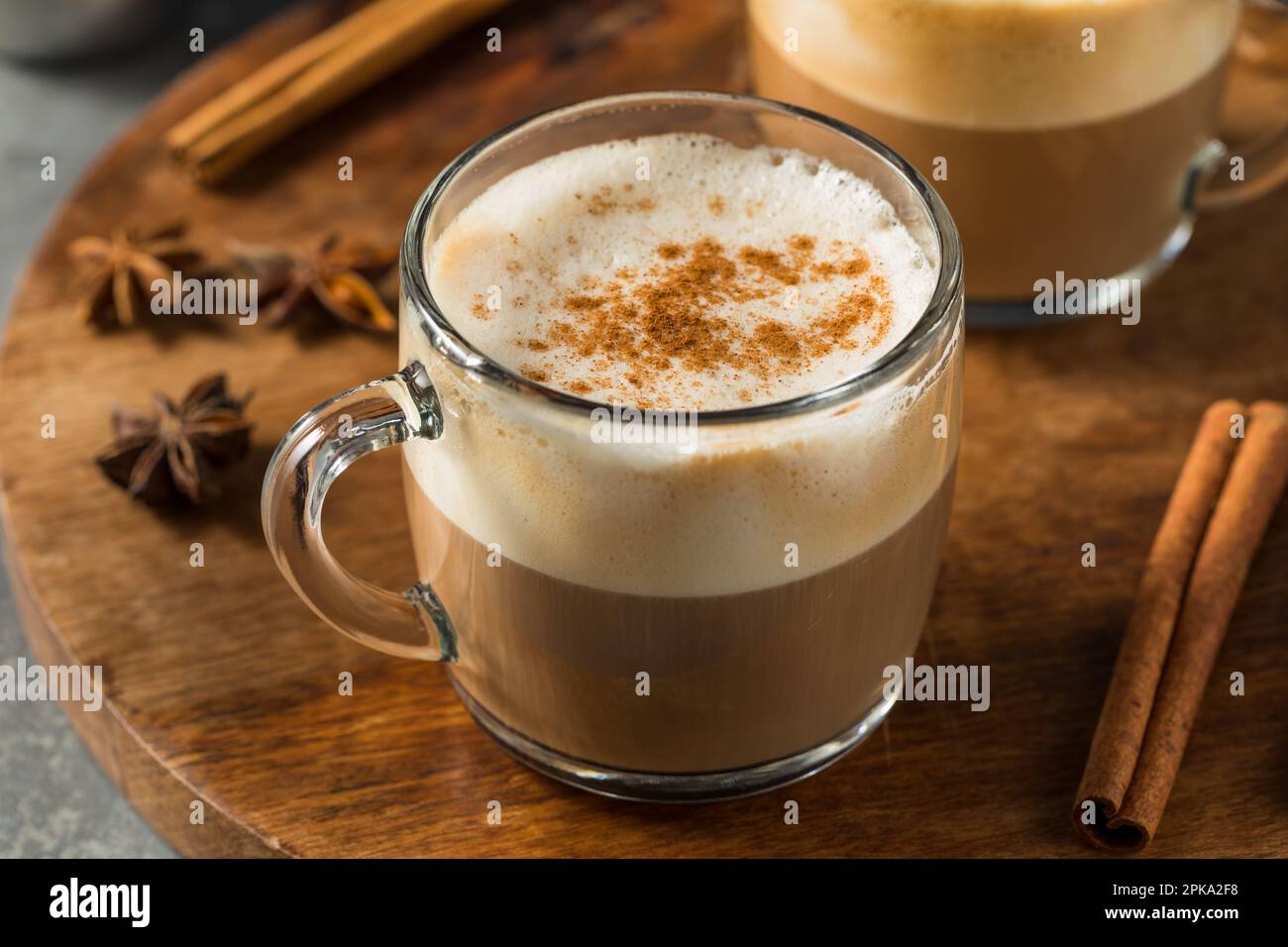 Warm Dirty Chai Latte with Milk and Spices Stock Photo