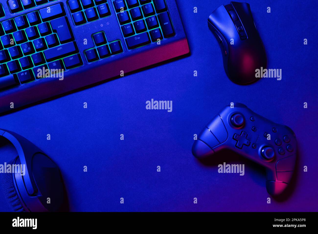 Adult using keyboard and mousepad to play video games on computer. Gamer  playing online game in