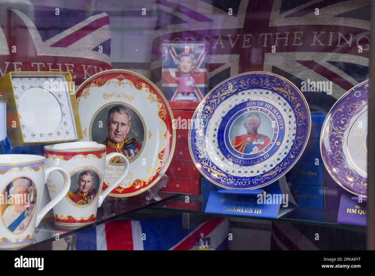 London, UK. 6th April 2023. Plates and souvenirs on sale in a shop in Central London as the preparations begin for the coronation of King Charles III, which takes place on May 6th. Stock Photo