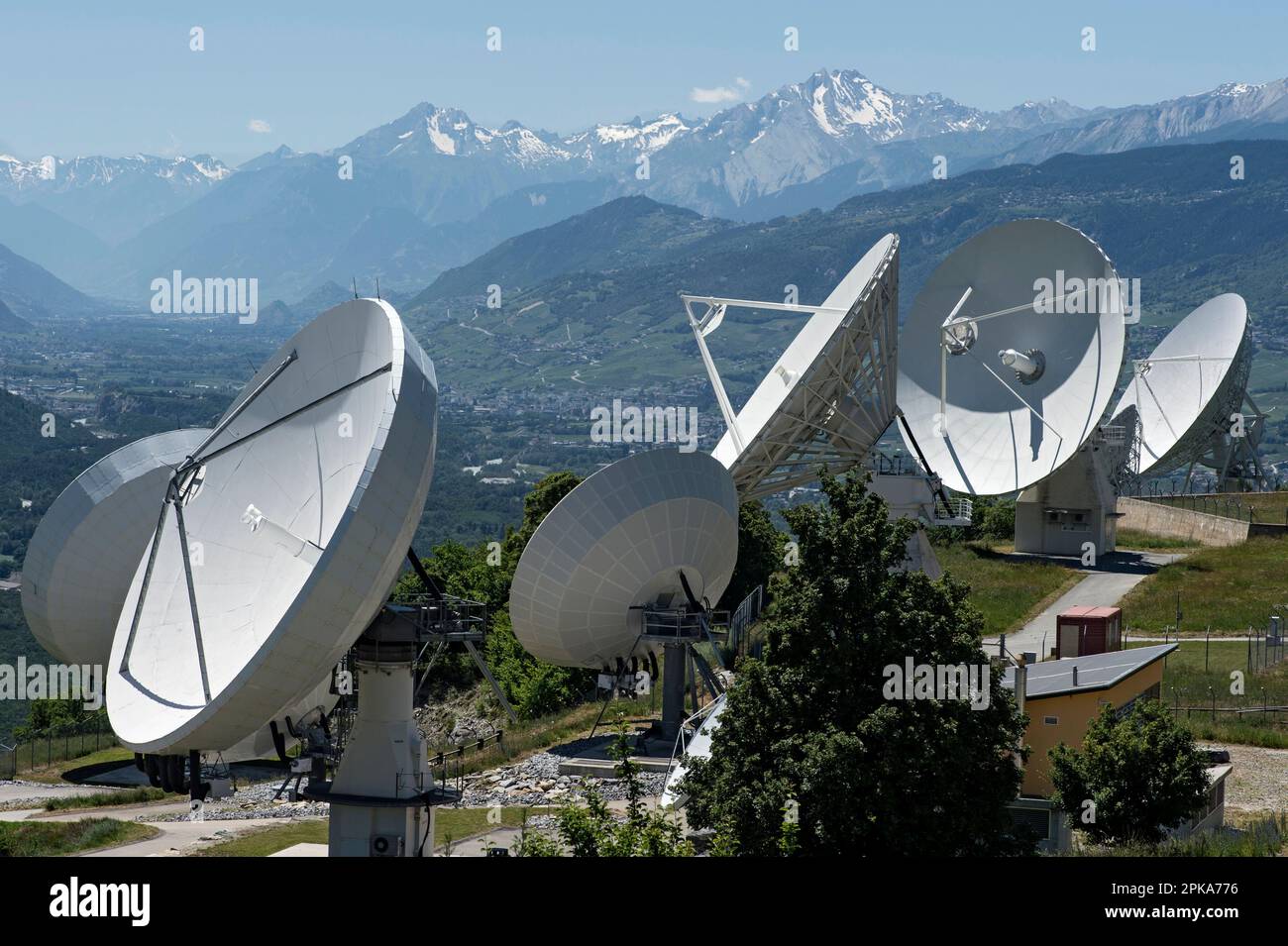 Parabolic antennas of a satellite ground station, Leuk, Valais, Switzerland Stock Photo
