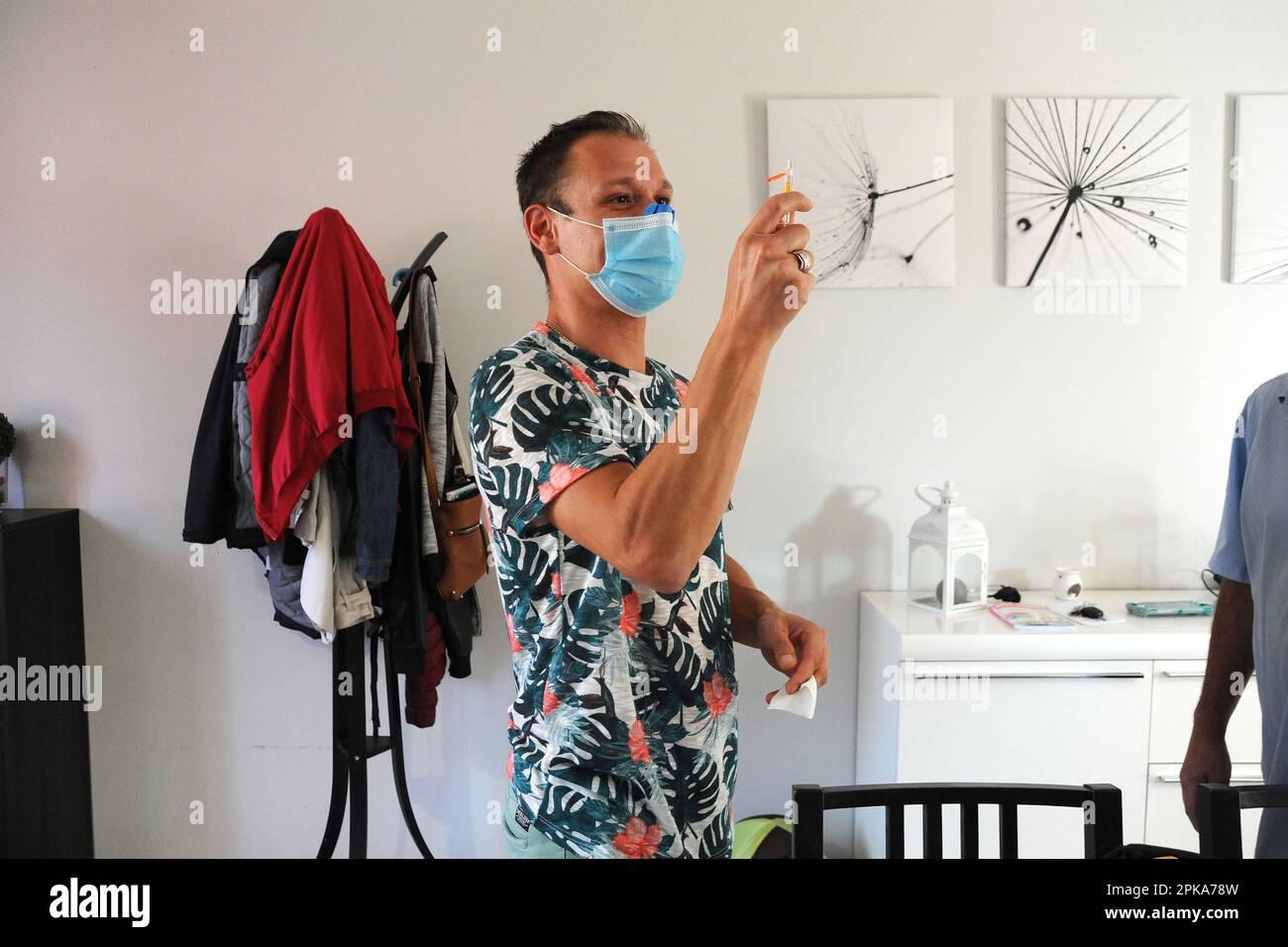 Liberal country nurse at the home of a patient for subcutaneous injection of Lovenox for the