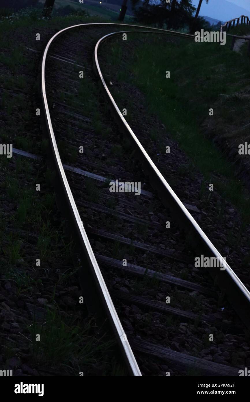 19.07.2022, Italy, South Tyrol, Oberbozen - Railway tracks shining in the dawn. 00S220719D421CAROEX.JPG [MODEL RELEASE: NO, PROPERTY RELEASE: NO (c) c Stock Photo