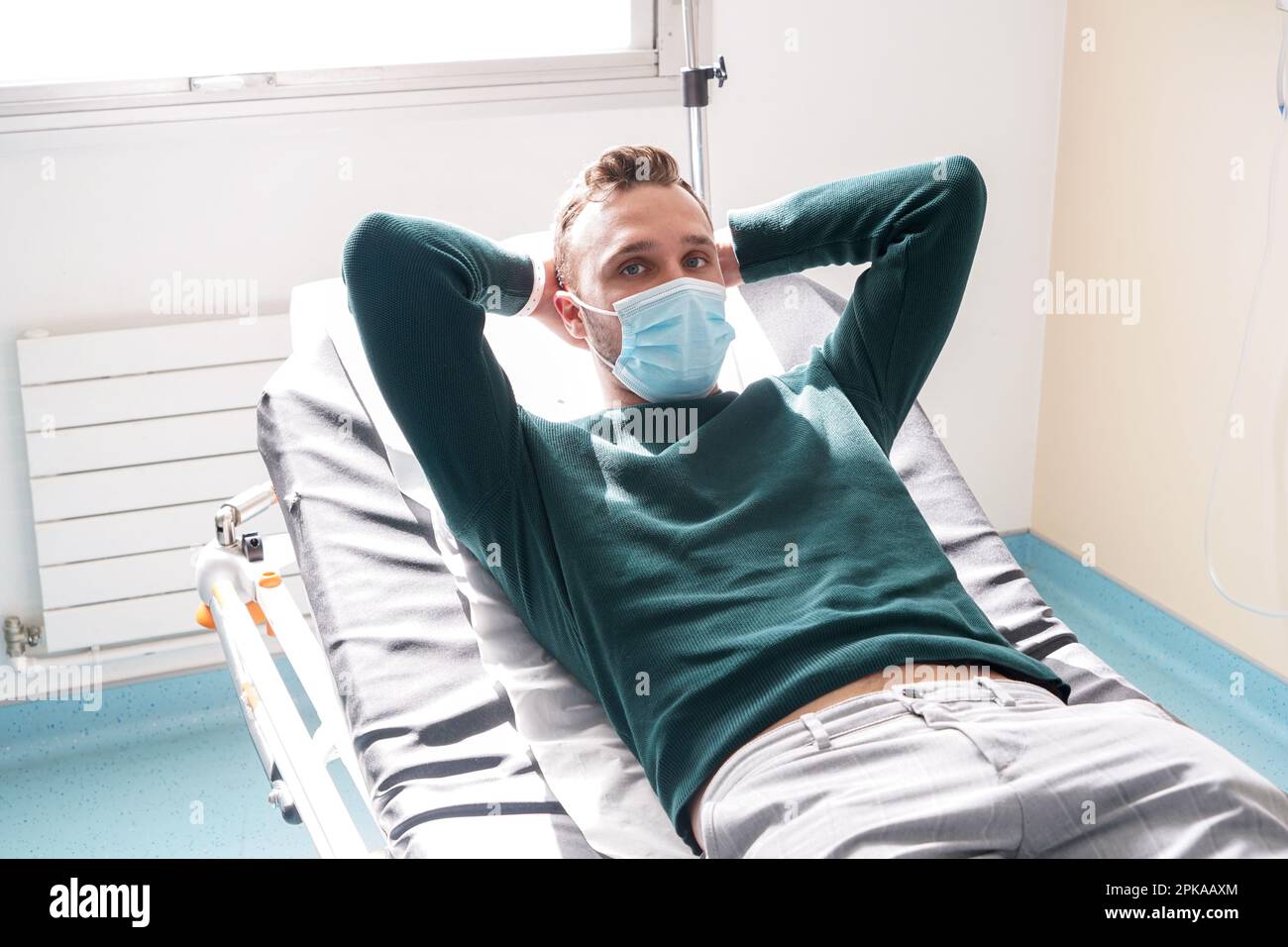 Patient in the emergency room of a university hospital. This young man ...