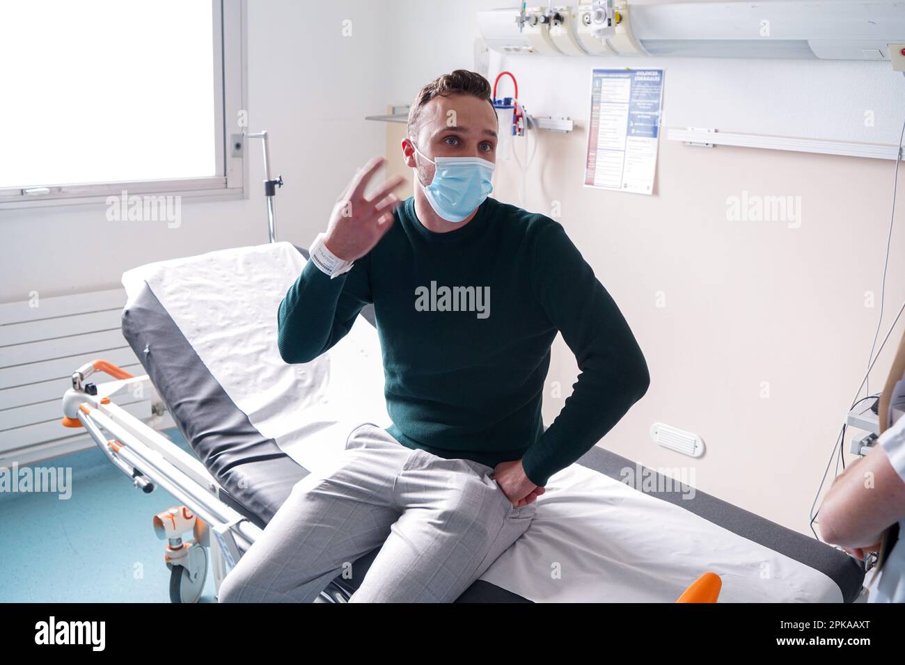 Patient in the emergency room of a university hospital. This young man ...