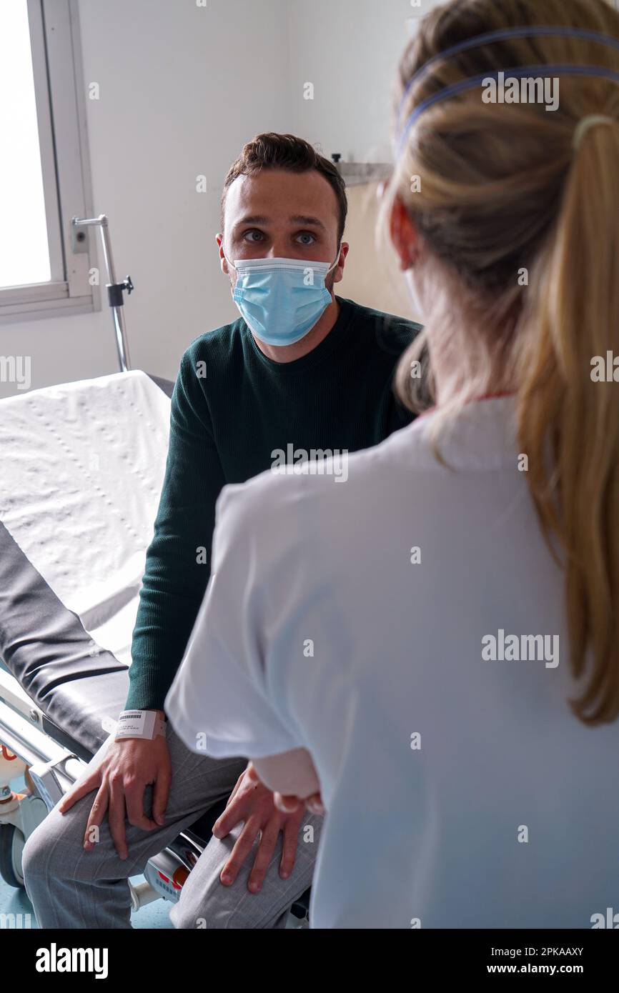 Patient in the emergency room of a university hospital. This young man ...