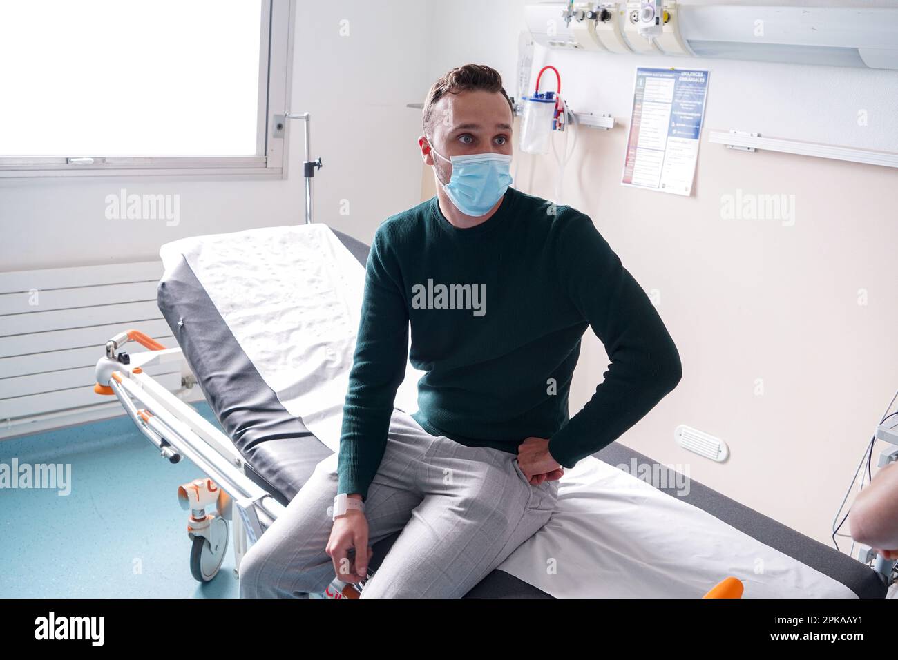 Patient in the emergency room of a university hospital. This young man ...