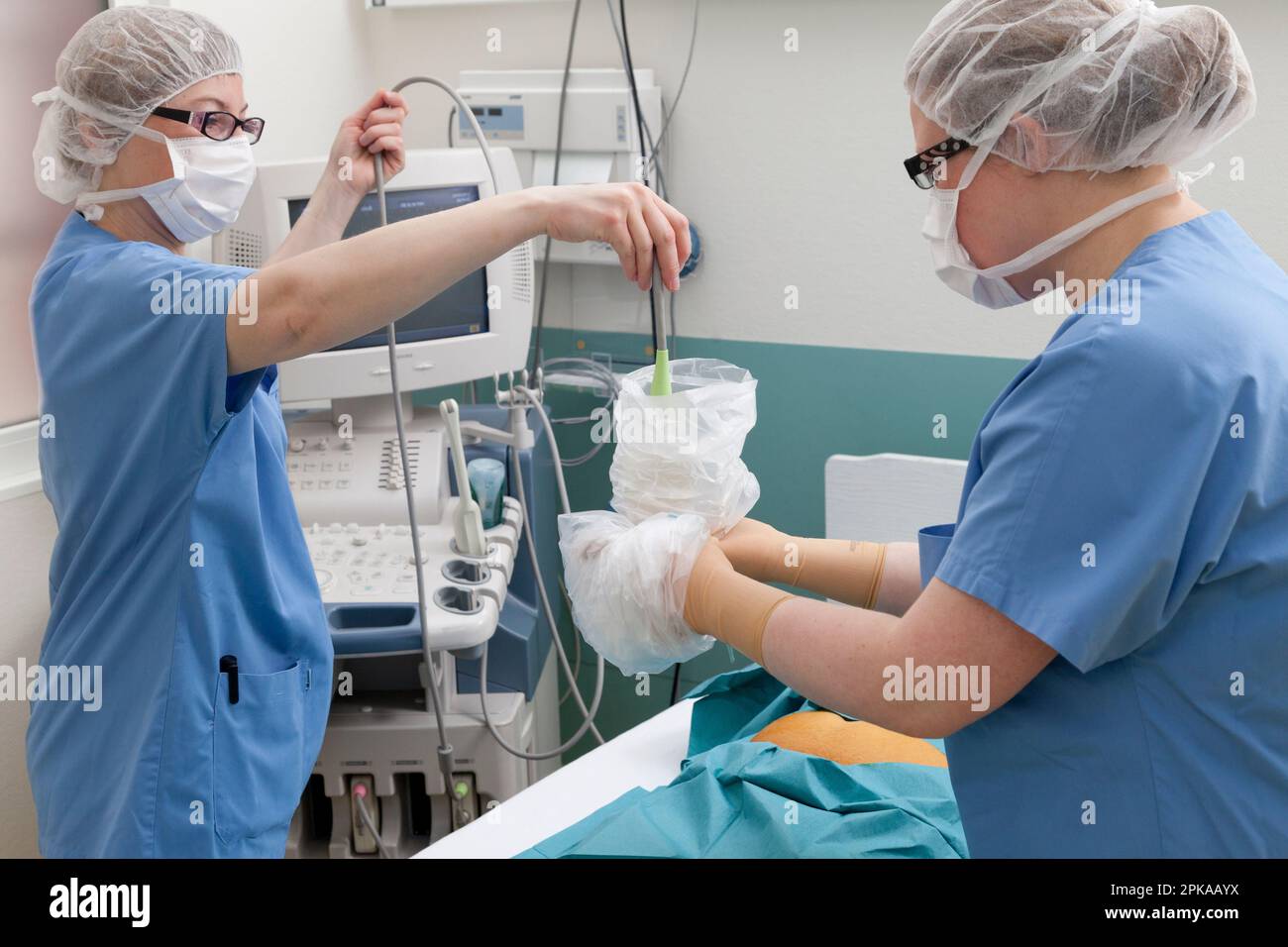 Sampling of amniotic fluid. Sterile preparation of the ultrasound probe ...