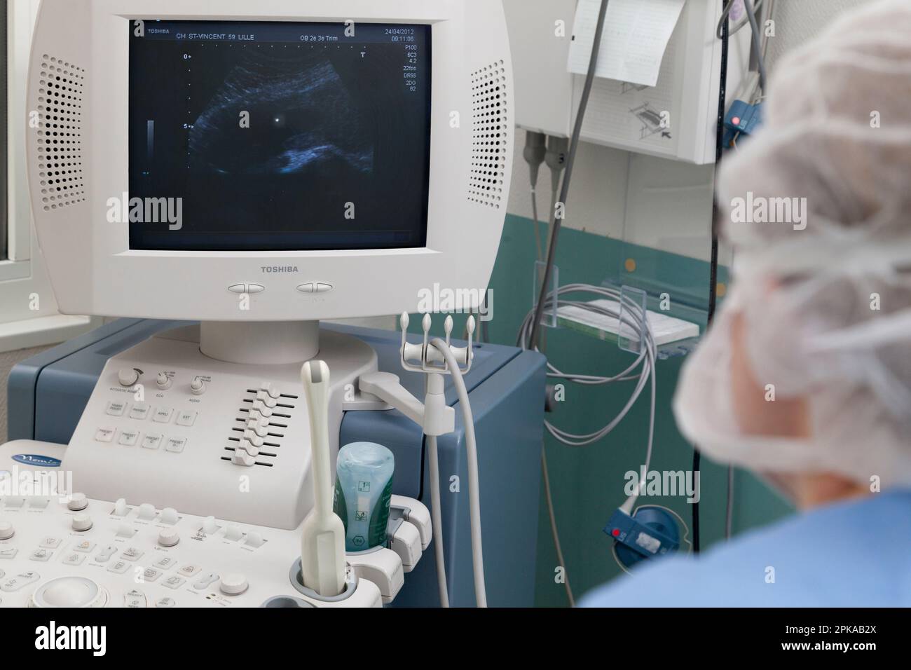 The sample of amniotic fluid is done under ultrasound control Stock
