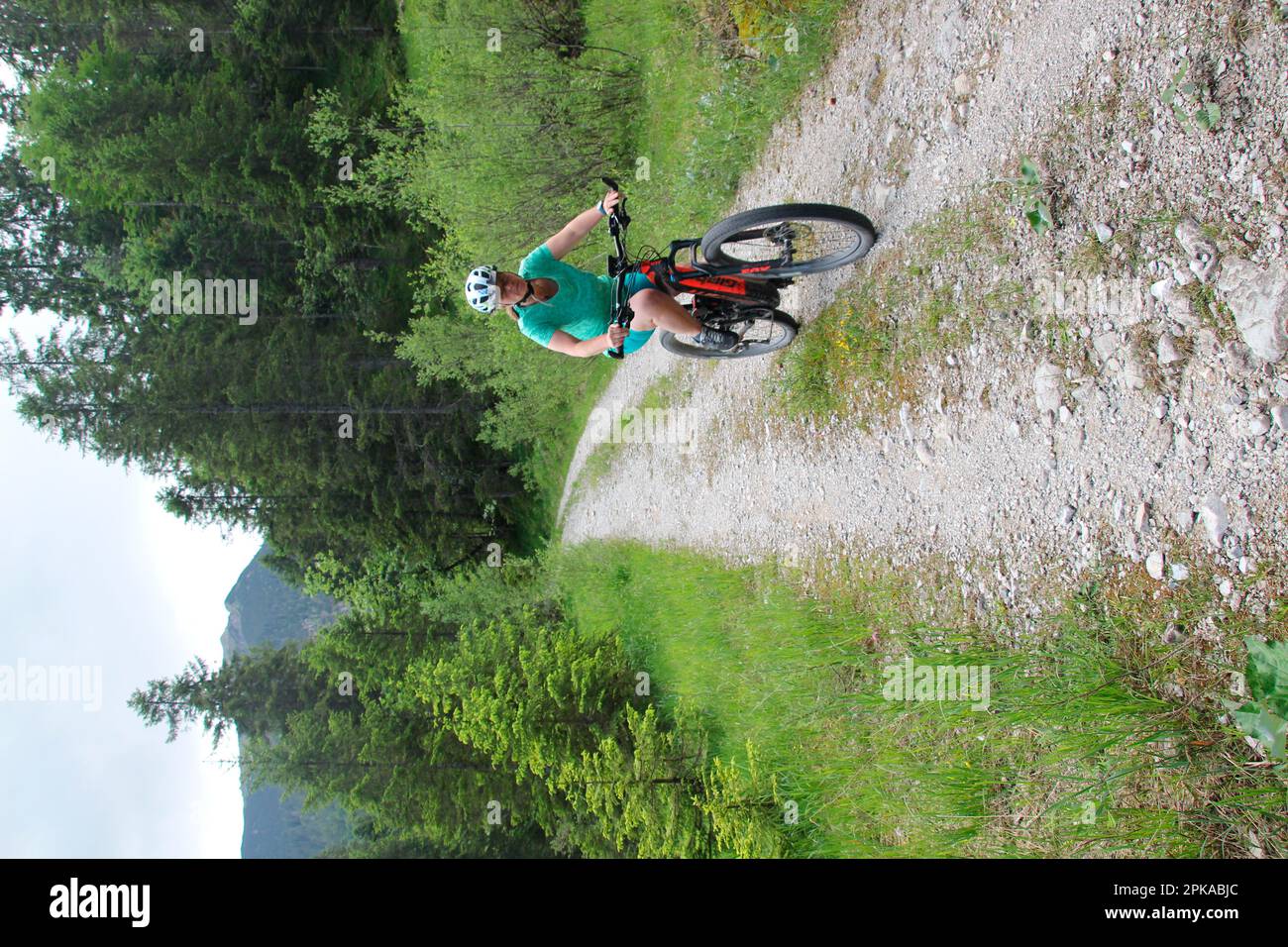 Woman on e-bike, cyclist, Fischbachtal, hiking trail, summer, Alpenwelt Karwendel, Krün, Germany, Bavaria, Upper Bavaria Stock Photo