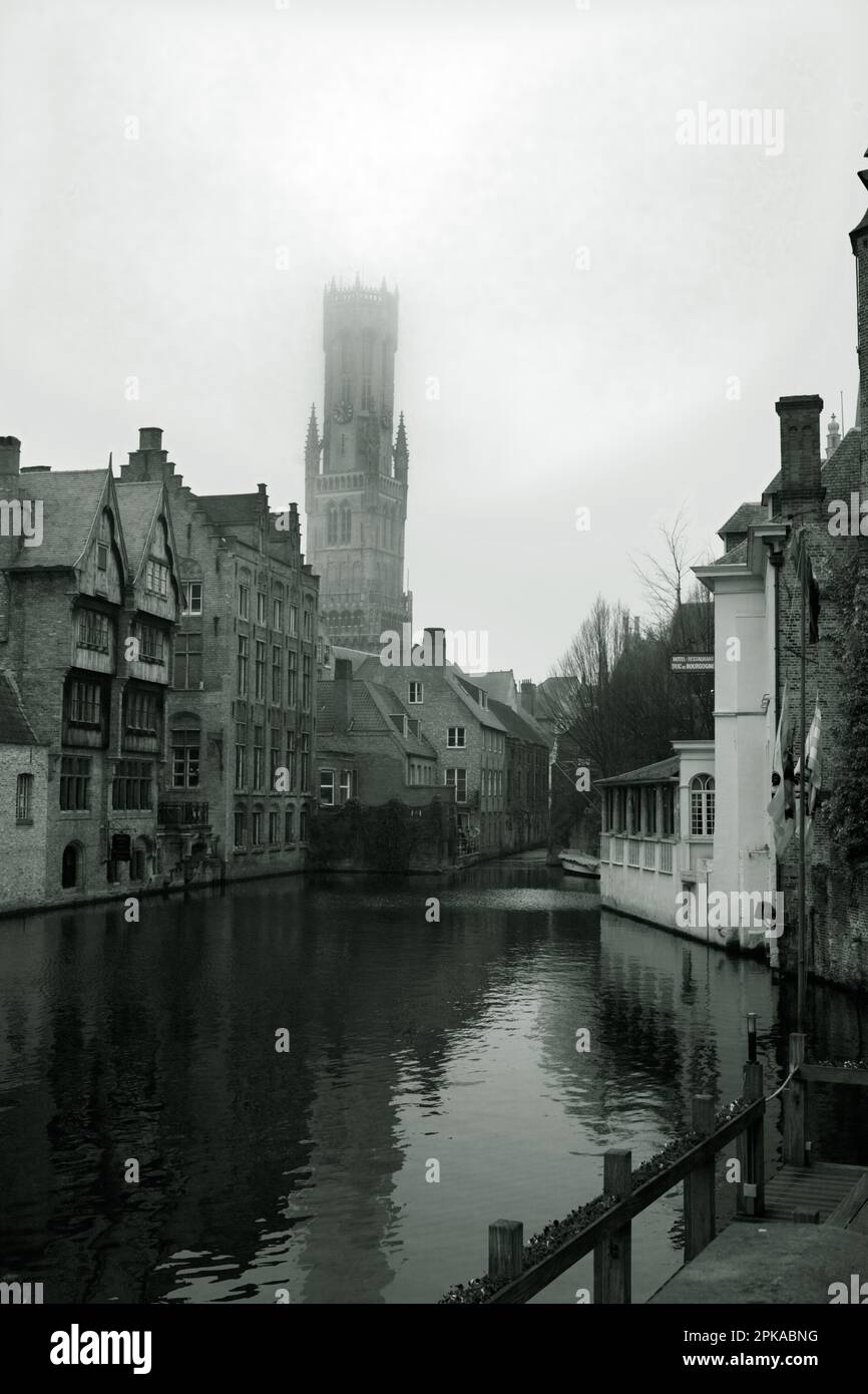 Rozenhoedkaai, (Rosary Quay), Bruges, Belgium: the Belfort, or Belfry Tower ascends into February mist in this, the classic view of Bruges Stock Photo