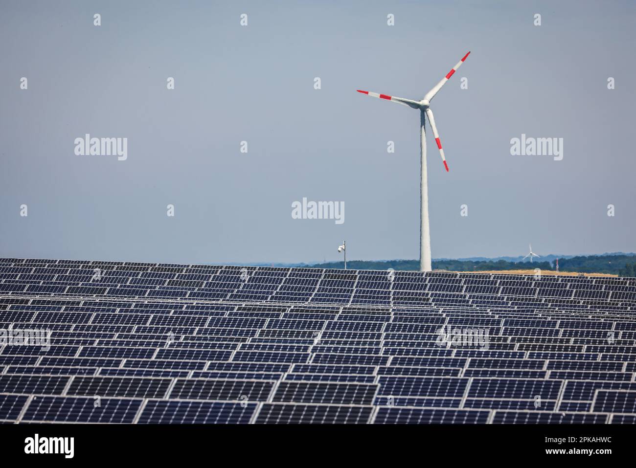 17.06.2022, Germany, North Rhine-Westphalia, Dortmund - Solar park and wind turbine on the Deusenberg slag heap. The open-air plant is located on a fo Stock Photo