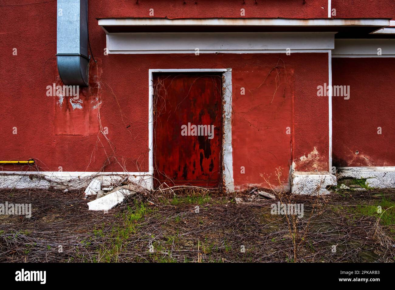Exterior facade of a red building in Bucharest, Romania Stock Photo