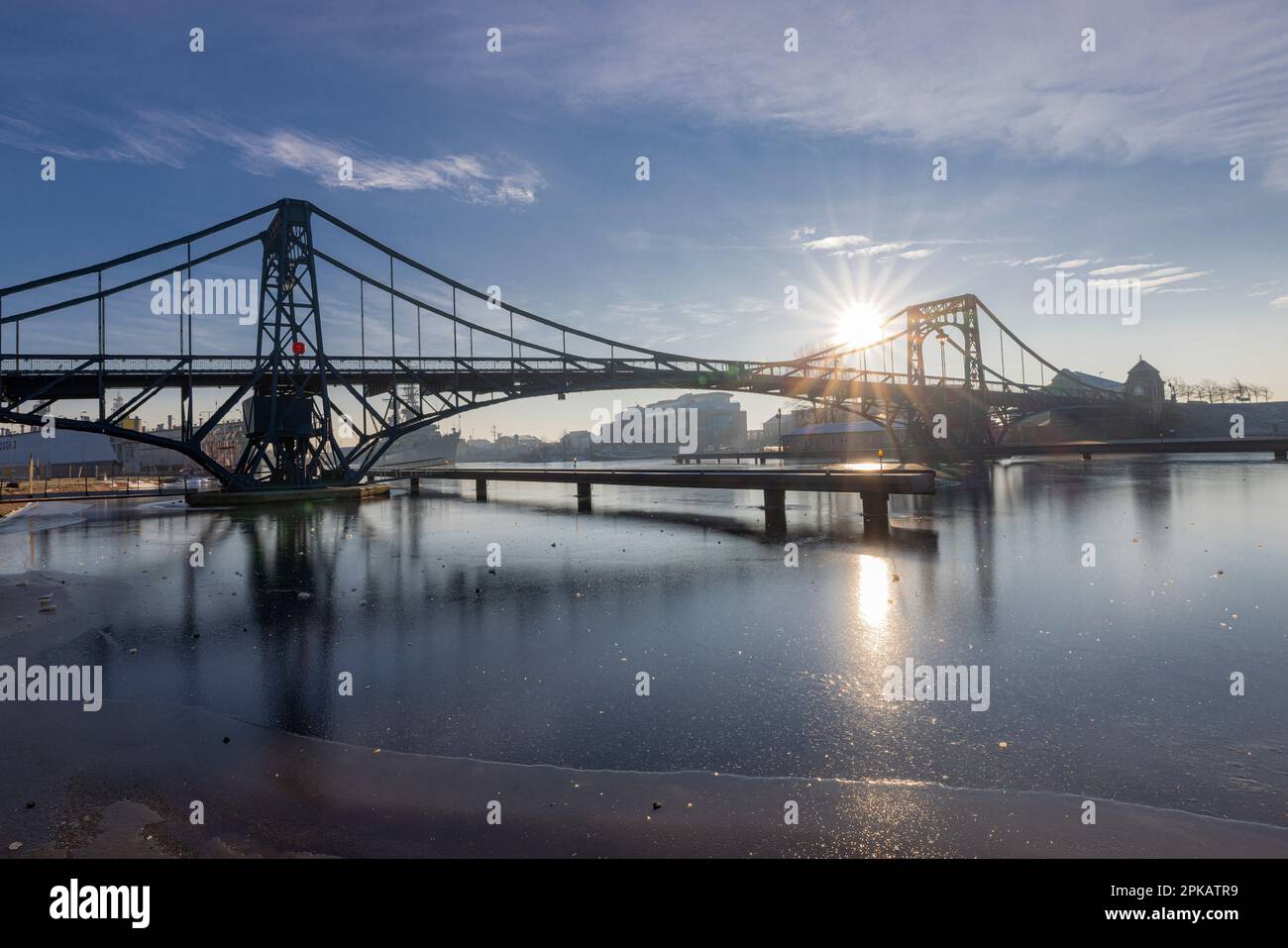 Winter atmosphere at Kaiser-Wilhelm-Bridge, icy harbor, backlight shot, Wilhelmshaven, Lower Saxony, Germany Stock Photo