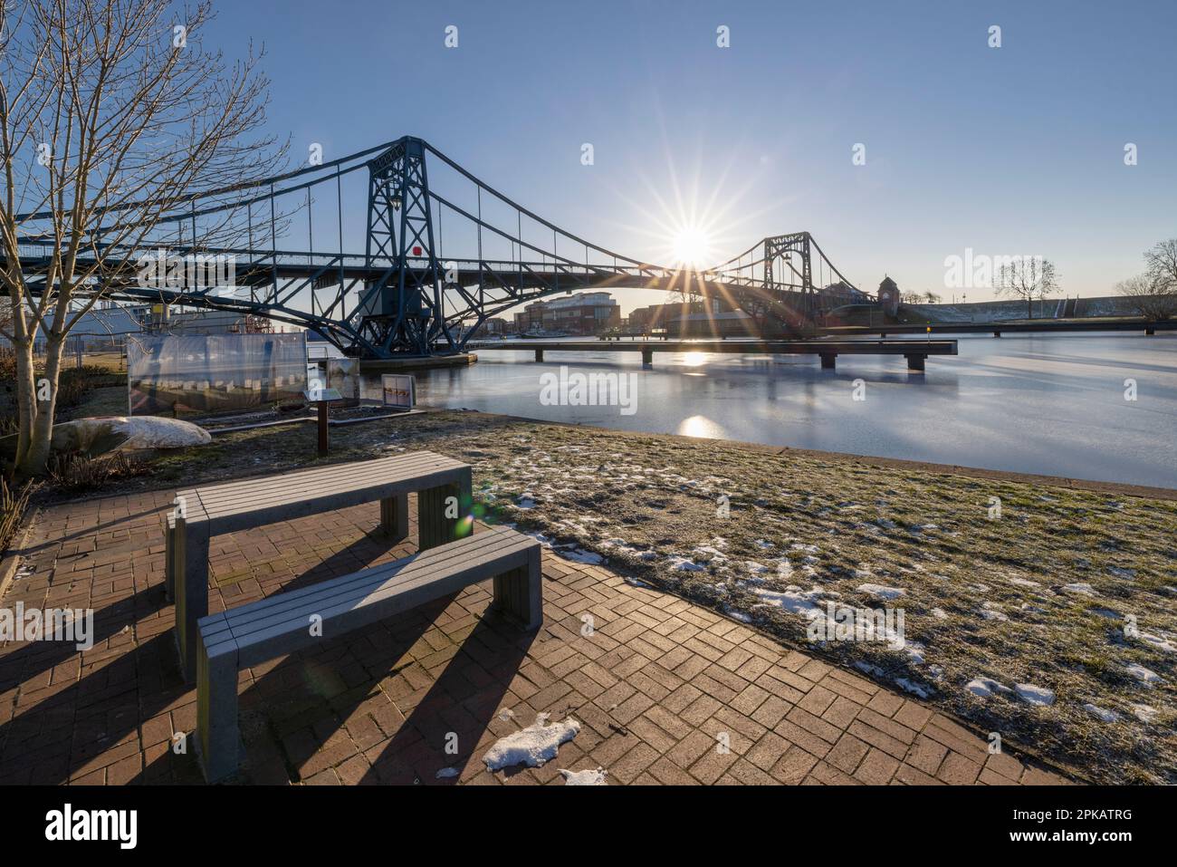 Winter atmosphere at Kaiser-Wilhelm-Bridge, icy harbor, backlight shot, Wilhelmshaven, Lower Saxony, Germany Stock Photo