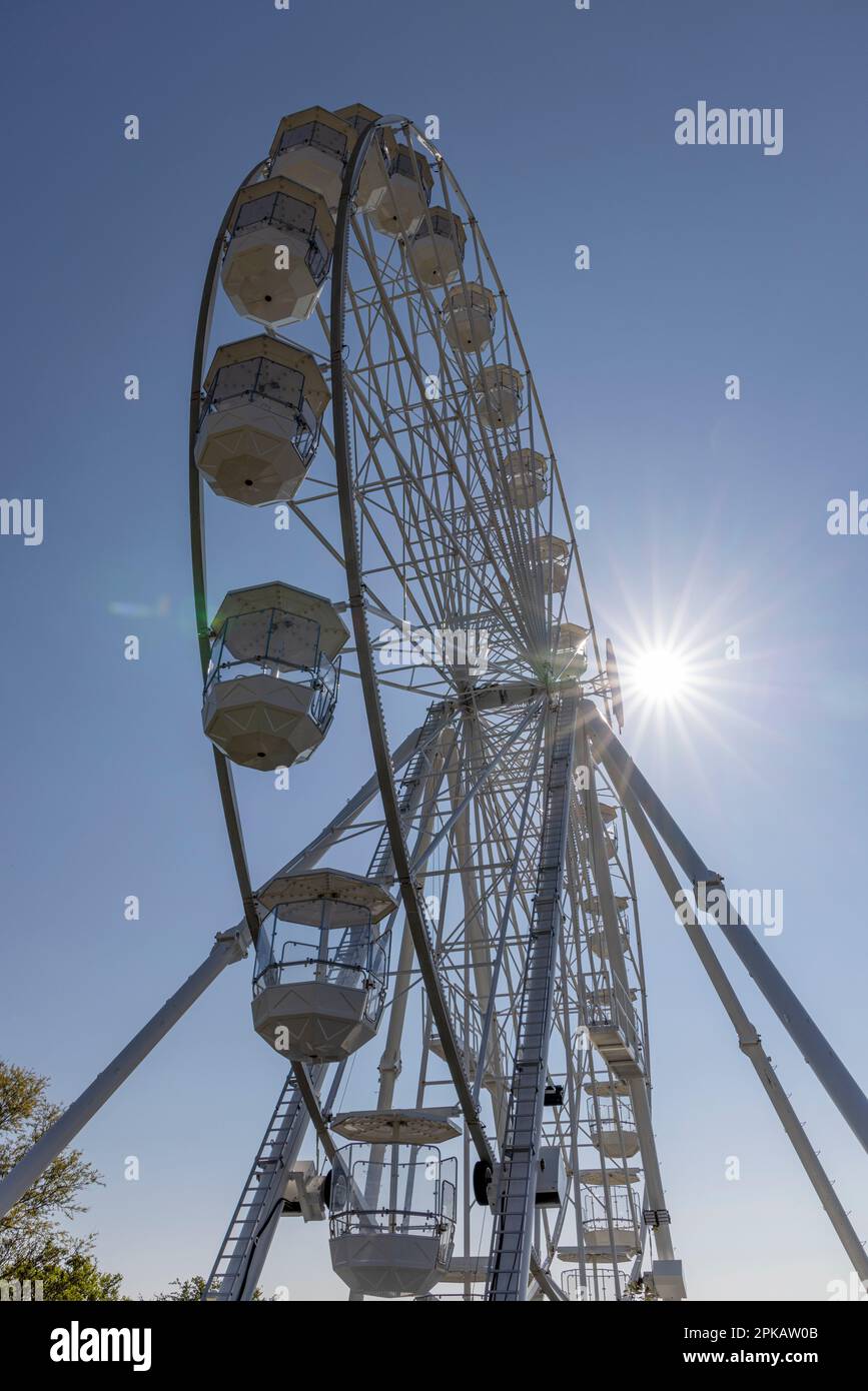 Deserted white Ferris wheel at Wangeroogkai, detail against blue sky, backlight shot, Wilhelmshaven, Lower Saxony, Germany Stock Photo
