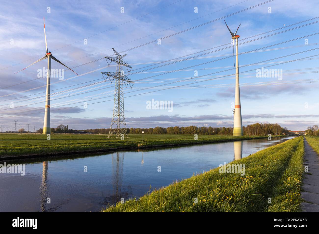 Overhead line, wind turbine on the Ems-Jade Canal, owned by Friesen-Elektra II GmbH & Co. KG, in Sande, municipality in the district of Friesland, Lower Saxony, Germany Stock Photo