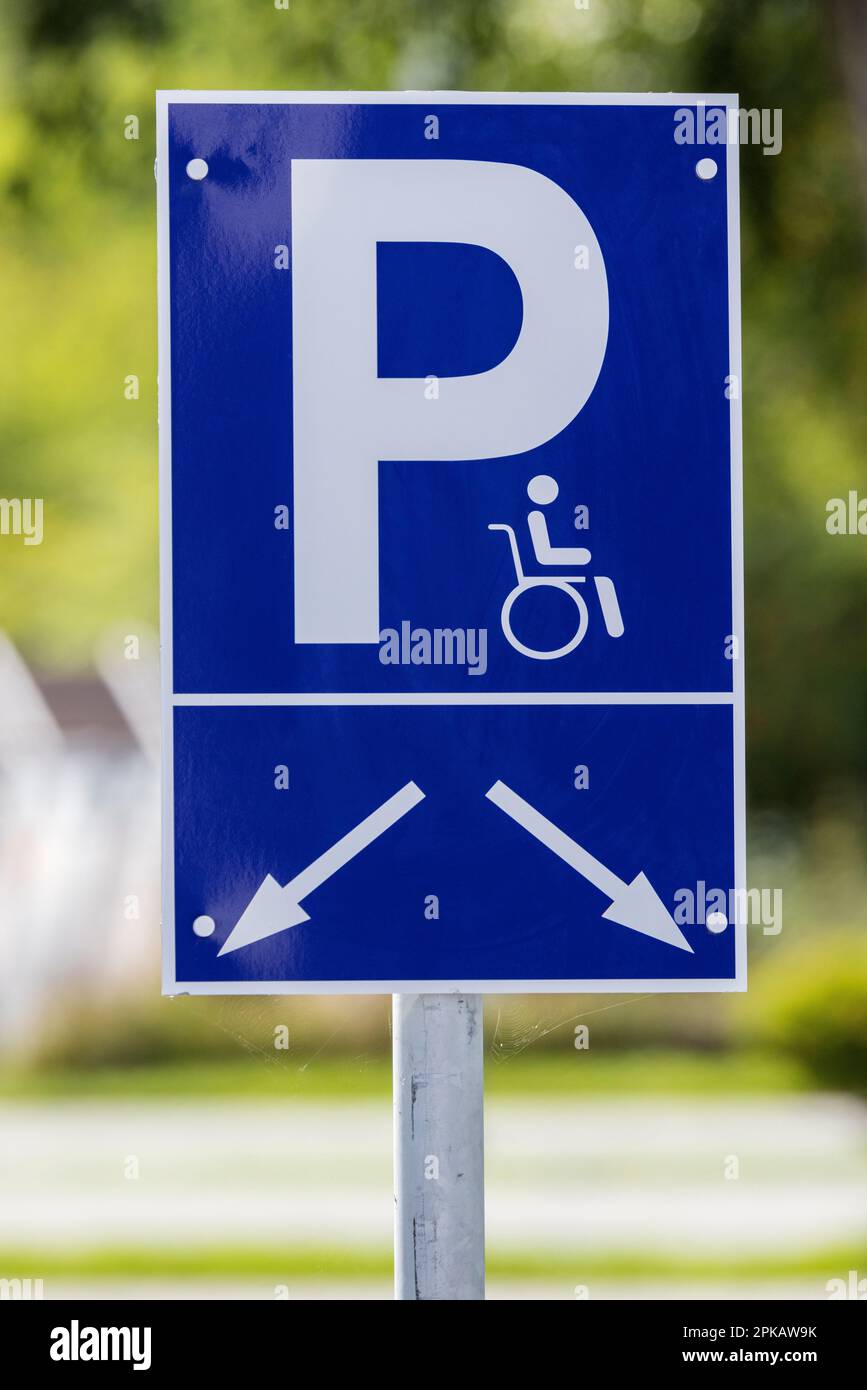 Signage disabled parking, pictogram of a wheelchair user, designated disabled parking spaces of an Aldi Nord store in Wilhelmshaven, Lower Saxony, Germany. Stock Photo