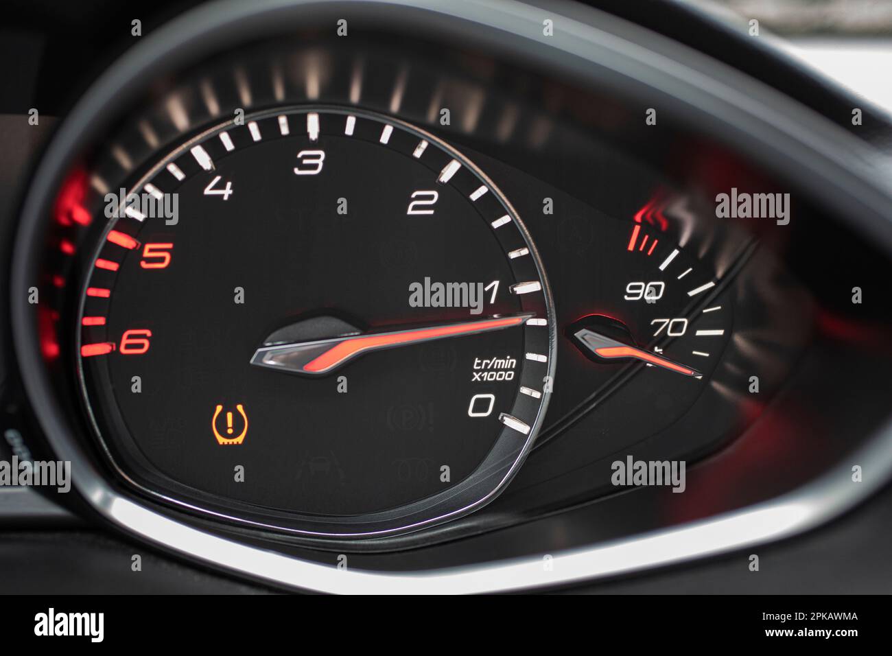 Car tachometer with yellow warning light, insufficient pressure on one