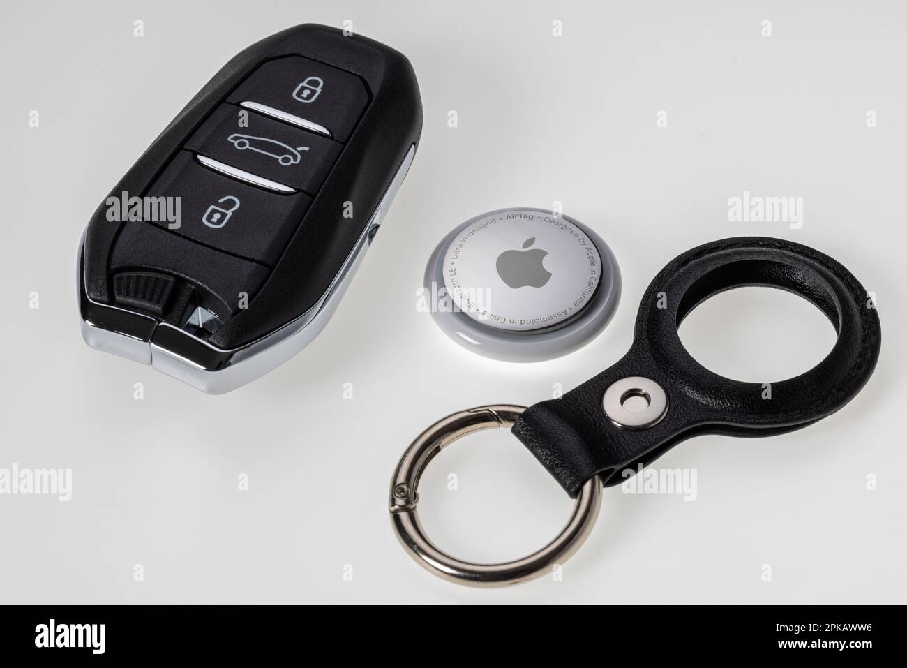 Apple AirTag, car key, key fob, detail, icon image, tracking tag, key finder, white background, Stock Photo