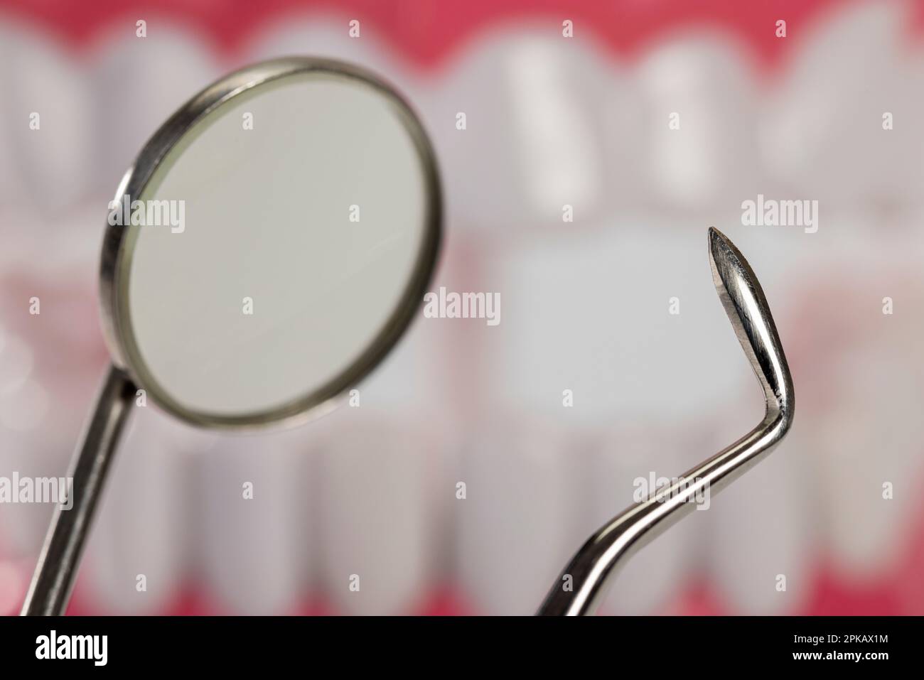 Mouth mirror, dental probe, detail, background dental care model
