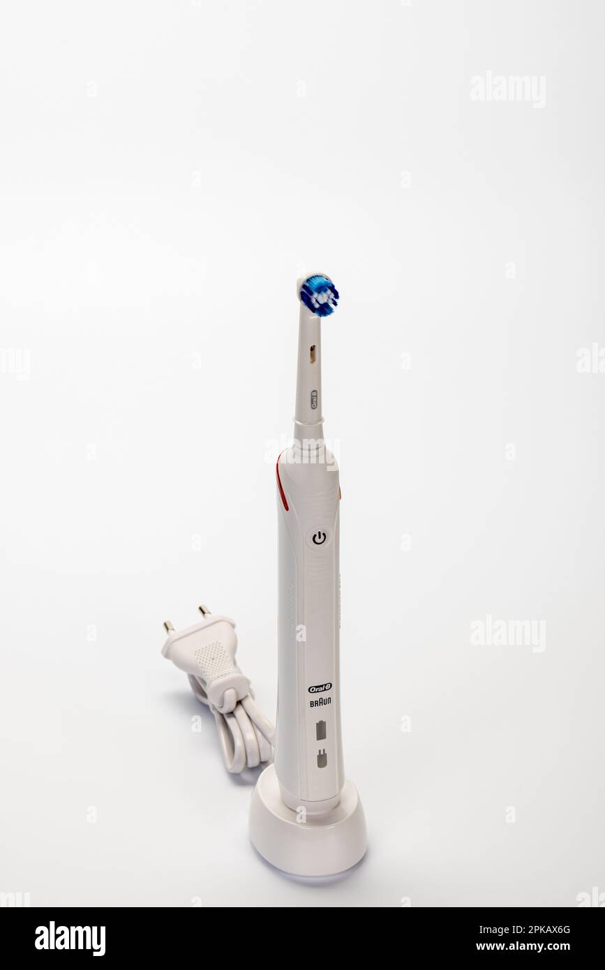 Braun Oral-B Type 3766 electric toothbrush on charging station, white  background Stock Photo - Alamy