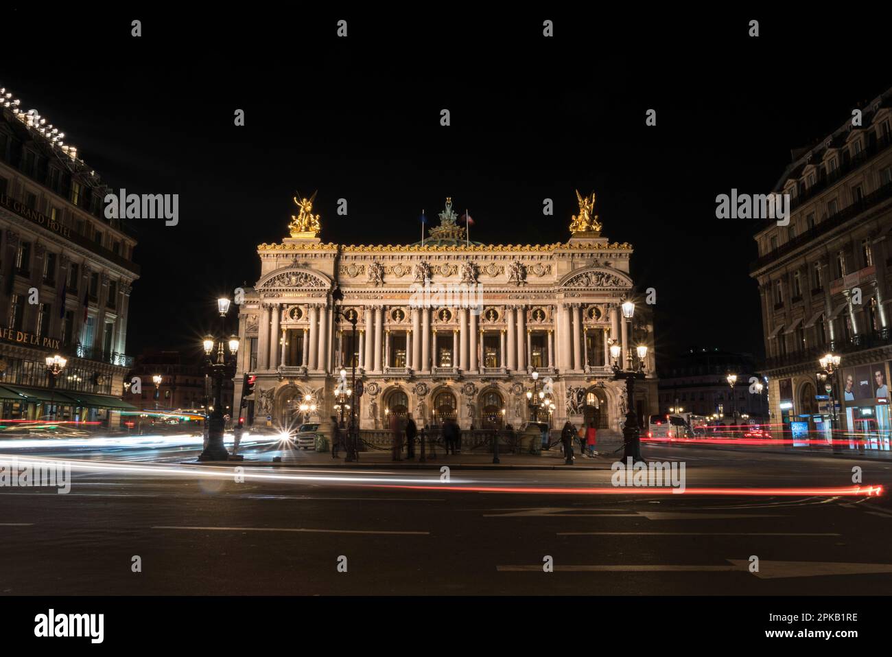Famous Paris Opera at Night, lights of the traffic leading around, France Stock Photo