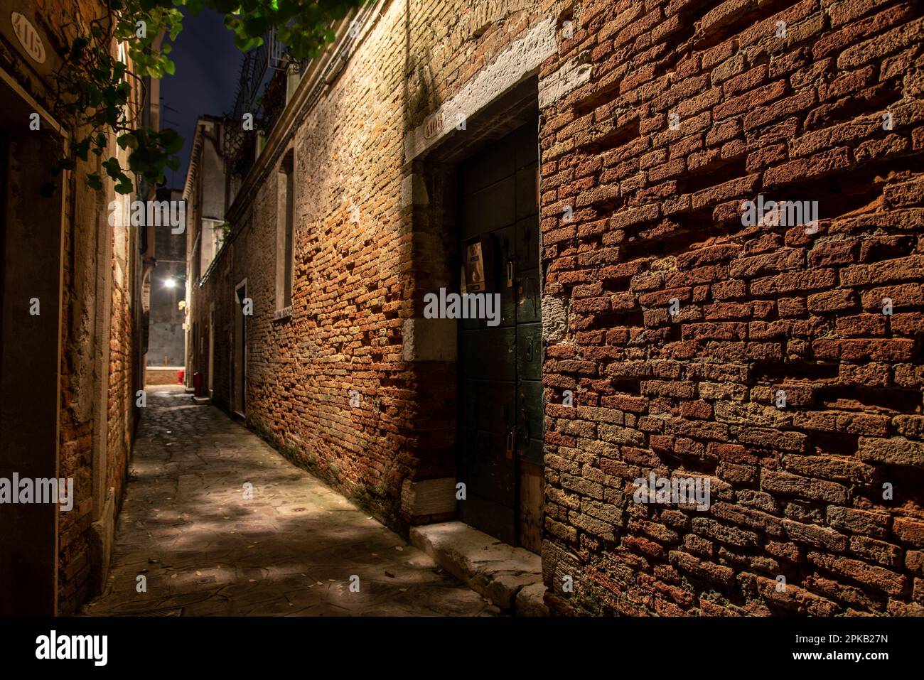 Old Brickwall in a narrow Alley in Cannaregio District, Venice, Italy Stock Photo