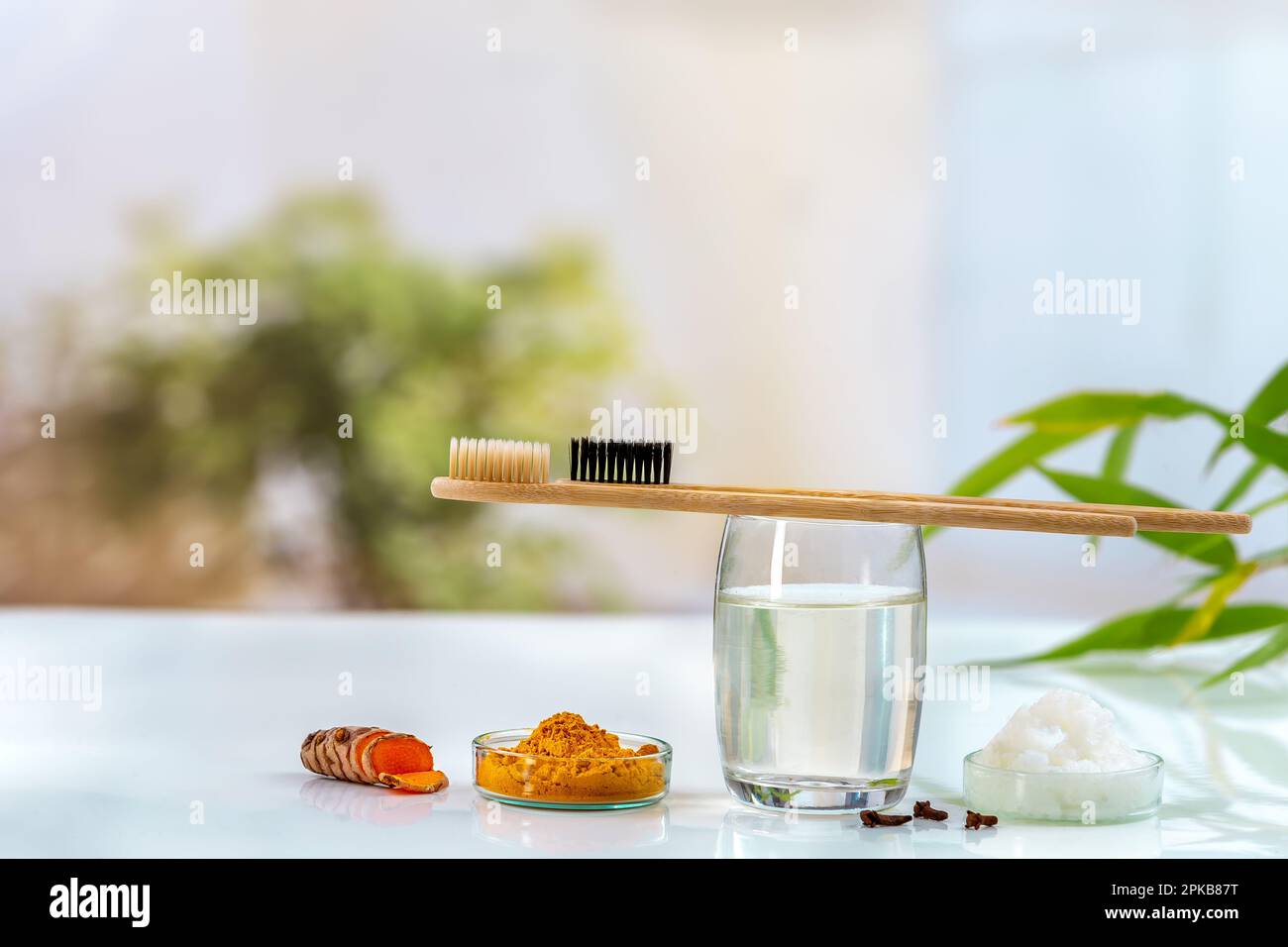 Homemade toothpaste made from turmeric, coconut oil and cloves Stock