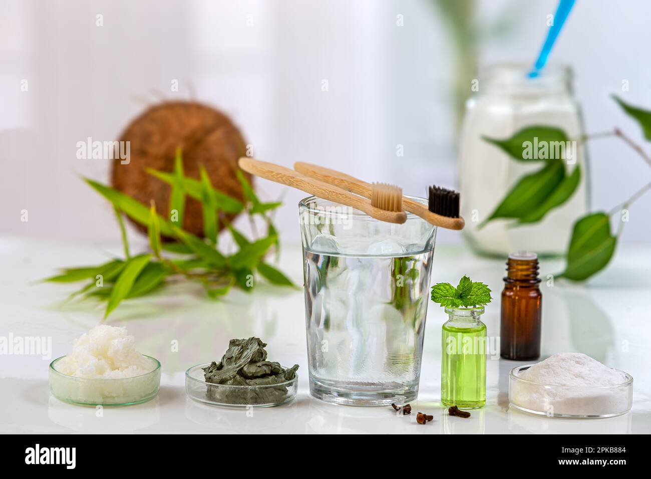 Homemade toothpaste made from baking soda, coconut oil, green clay and