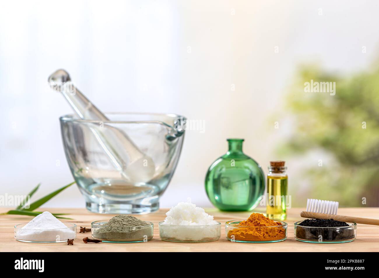 Homemade toothpaste made from charcoal, turmeric, coconut oil, clay