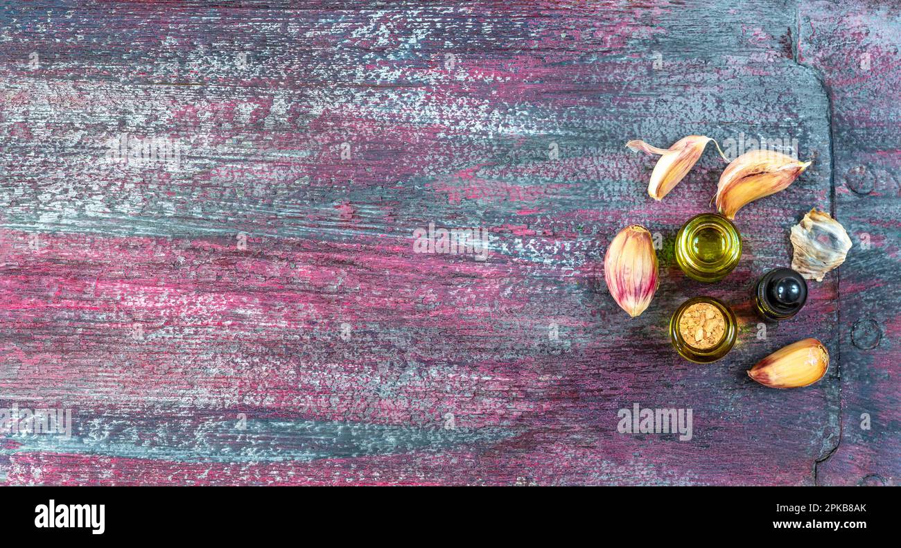 Bottles of garlic essential oil Stock Photo Alamy
