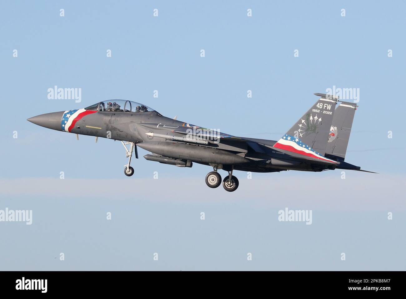 USAF F-15E assigned to the 48th Fighter Wing landing at RAF Lakenheath. Aircraft carries a special colour scheme for the 48th FW 70th anniversary. Stock Photo