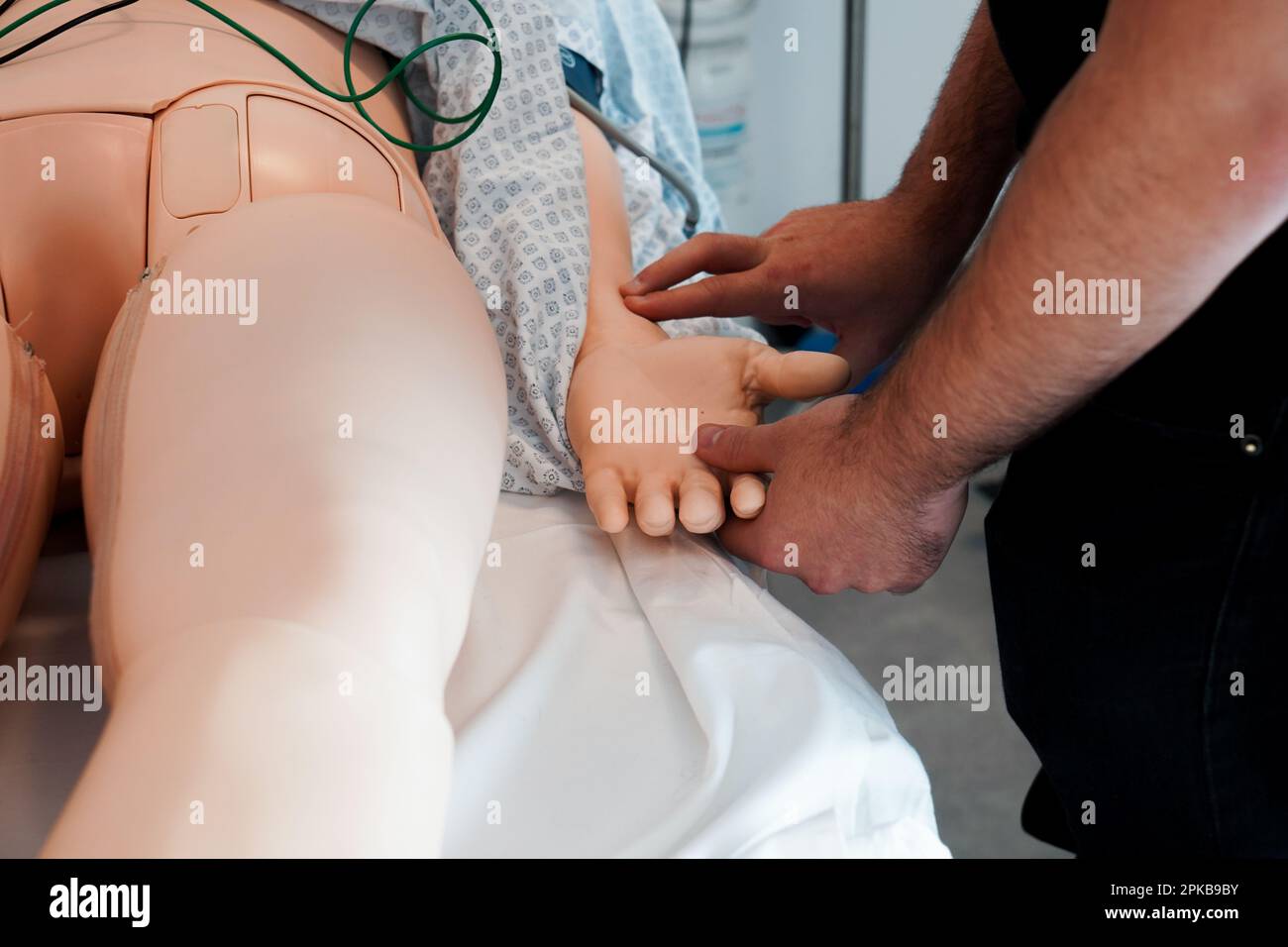 Nurses and emergency nurses undergo training at School of Medicine on emergency procedures and resuscitation. Simulation session on a SimMan dummy. Stock Photo