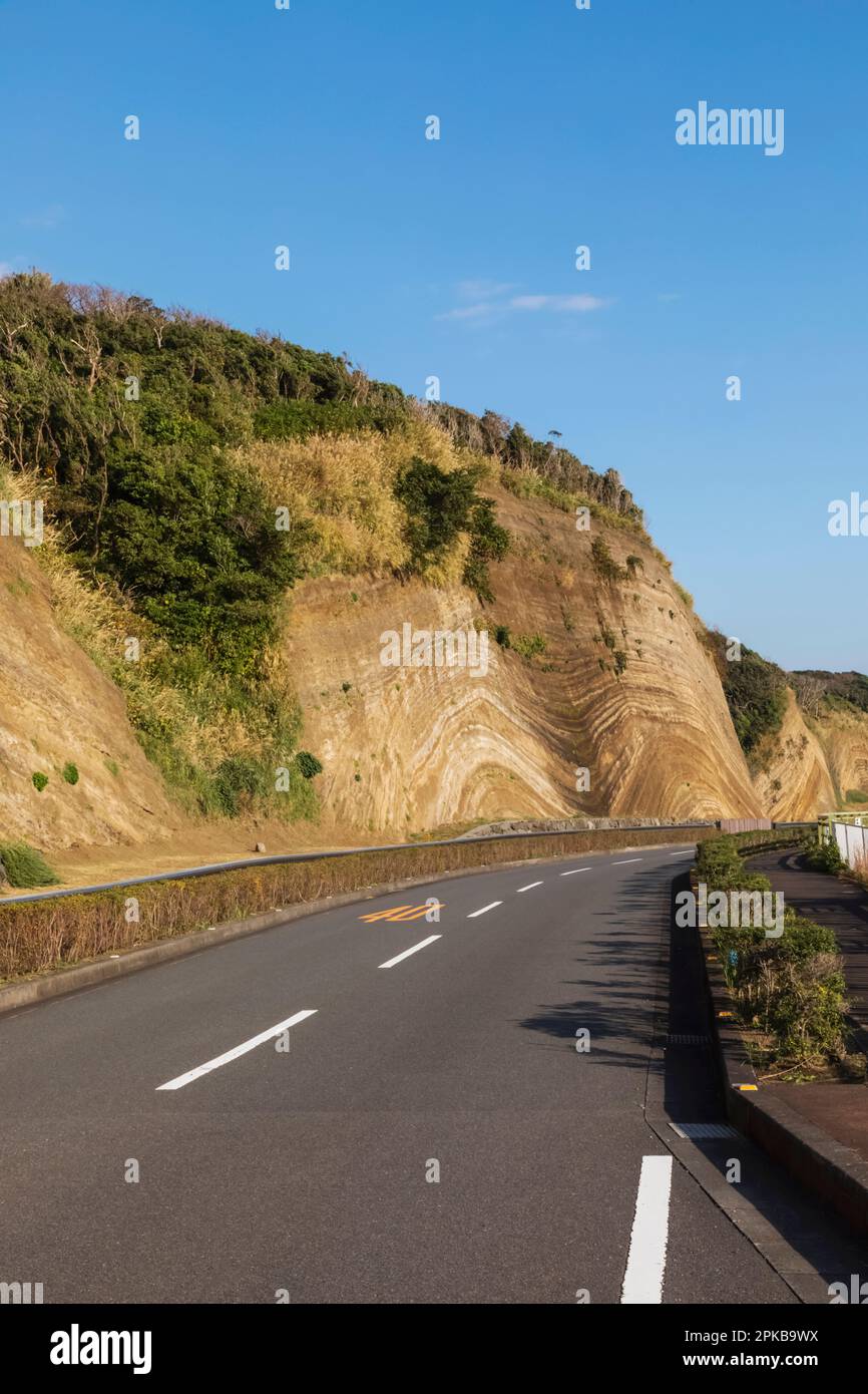 Japan, Honshu, Izu-Oshima Island, Road and Stratum Section of Cliffs Stock Photo