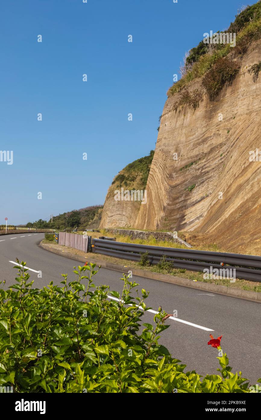 Japan, Honshu, Izu-Oshima Island, Road and Stratum Section of Cliffs Stock Photo