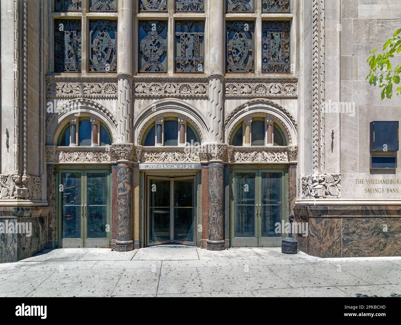 Williamsburgh Savings Bank’s limestone base is richly carved with savings and banking symbols