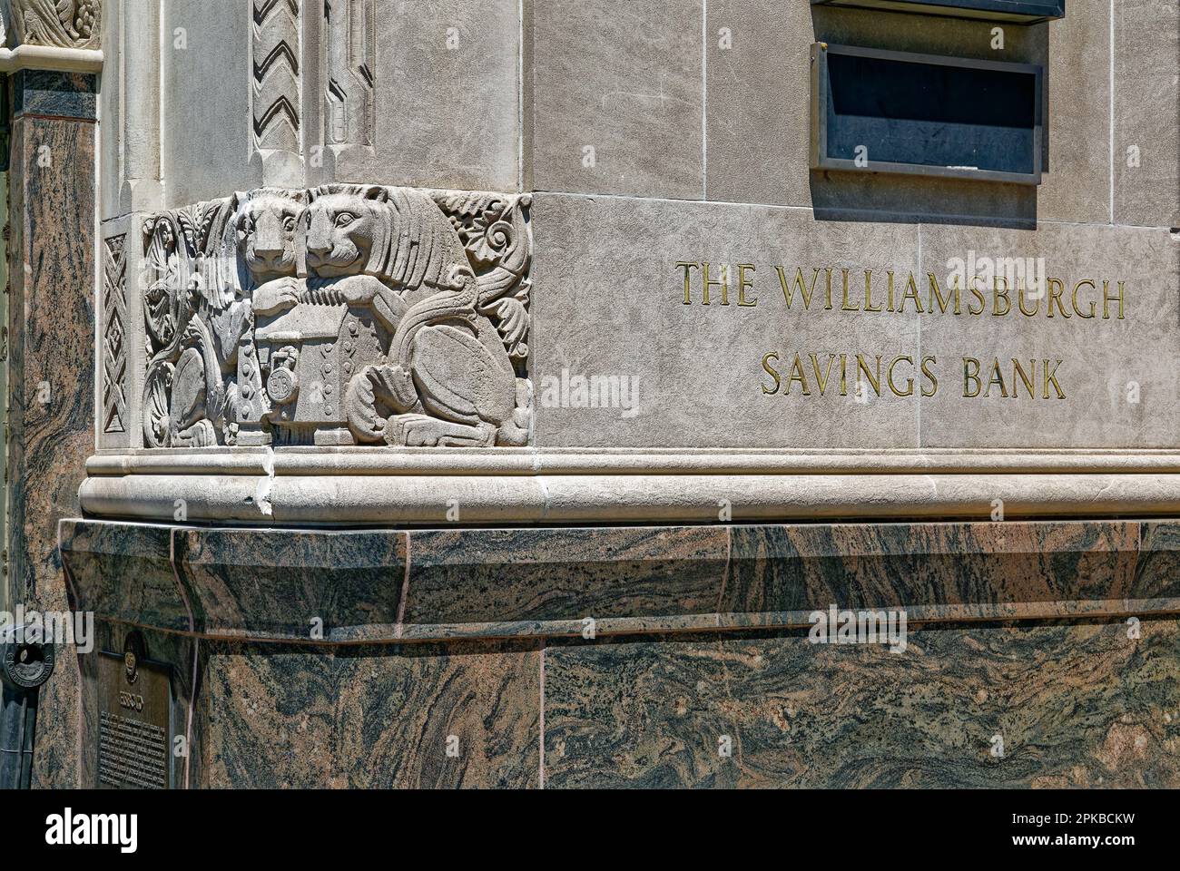 Williamsburgh Savings Bank’s limestone base is richly carved with